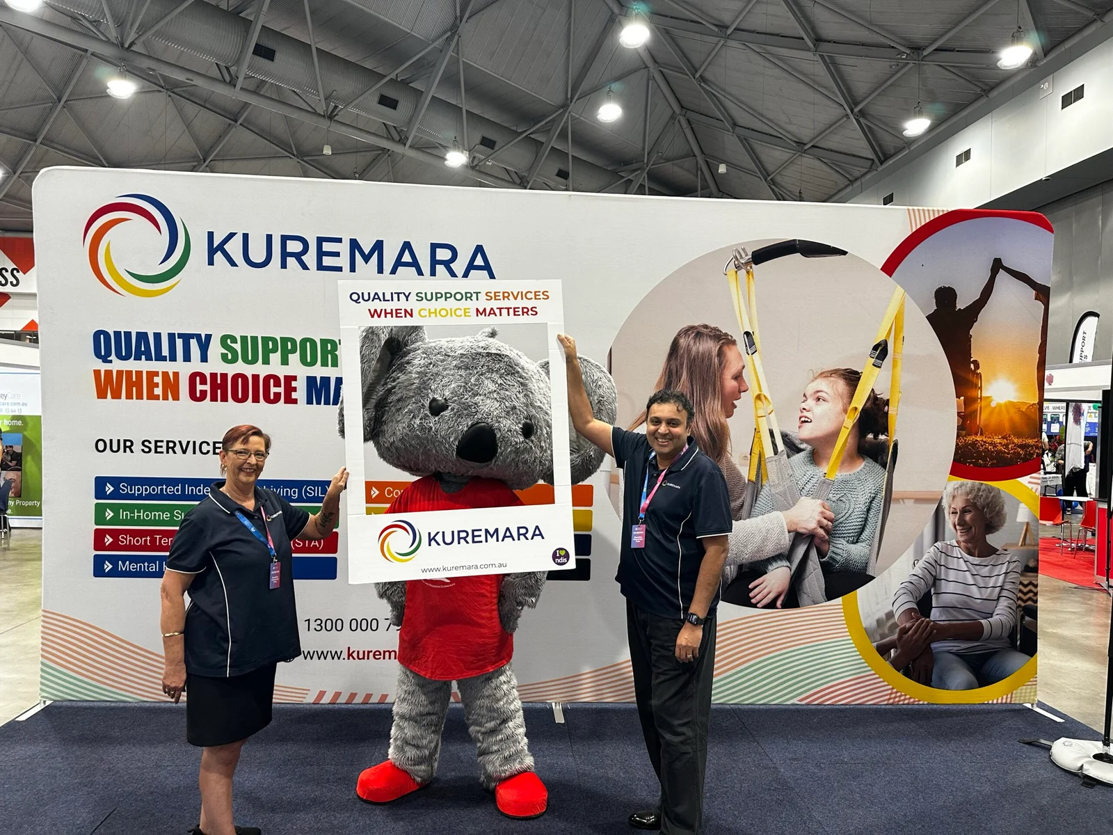 Kuremara Team Posing at Stand with ConnectionFEST Mascot